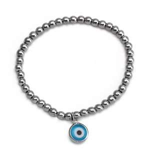 Detailed close-up of a silver beaded bracelet featuring a classic Evil Eye pendant