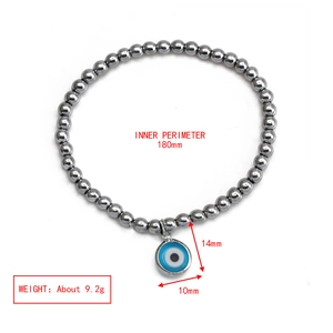 Detailed view of beaded hematite bracelet with blue evil eye charm and size dimensions