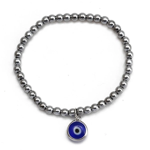 Detail shot of hematite beaded bracelet with blue evil eye pendant on white background