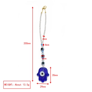 Detailed view of Hamsa Hand and Evil Eye keychain with blue crystal beads and dimensions