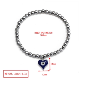 Macro shot of evil eye heart pendant beaded bracelet with size and weight dimensions