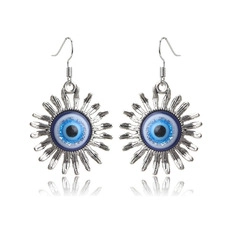 Detailed view of silver evil eye sunburst charms for DIY jewelry and necklace making