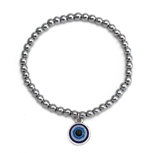 Detailed view of evil eye charm pendant on silver-grey beaded bracelet for protection
