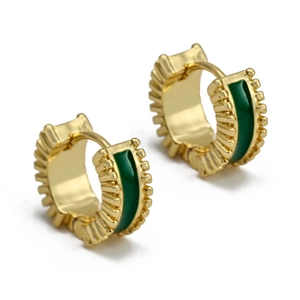 Detailed close-up of C-shaped gold hoop earrings with green enamel and ribbed texture