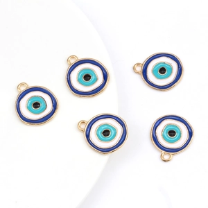Detailed macro view of five blue enamel evil eye pendants with gold alloy metal edges
