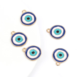 Detailed view of five blue evil eye charms with golden metal edges for jewelry making