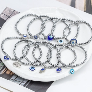 11-piece Bohemian hematite beaded bracelet set with blue Evil Eye and Hamsa Hand charms
