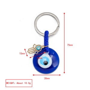 Detailed view of evil eye keychain with gold horseshoe and Hamsa hand dimensions
