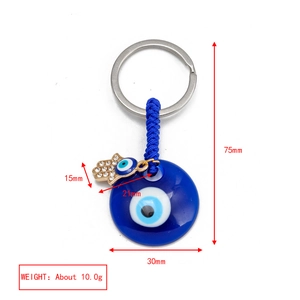 Detailed view of Evil Eye and Hamsa keychain with dimensions and 10g weight specifications