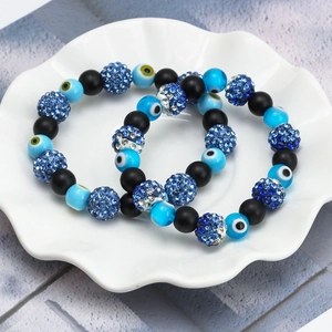 Dual Evil Eye beaded bracelets set with black matte beads and blue sparkling crystals