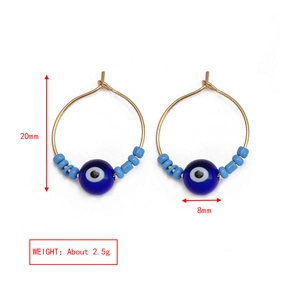 Detail showing 20mm gold hoop earrings with colorful beads and blue evil eye charms