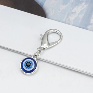Silver lobster clasp keychain with blue evil eye pendant on a white background