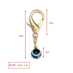 Spécifications de taille du porte-clés œil grec doré avec mesure de longueur de 40 mm