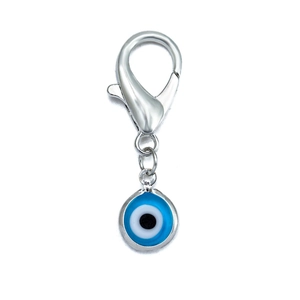 Detail of blue evil eye charm with silver lobster clasp on a clean white background