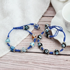Adjustable woven Evil Eye bracelet with blue cord, crystal spacers and colorful beads