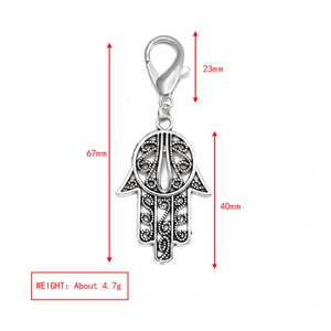 Detailed view of Hamsa Hand keychain with 67mm total length and vintage hollow pattern