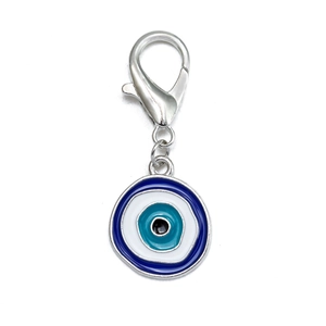 Close-up of blue evil eye hamsa charm with silver lobster clasp and enamel details
