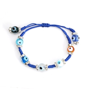 Detailed view of evil eye braided bracelet with colorful glass beads and crystal spacers