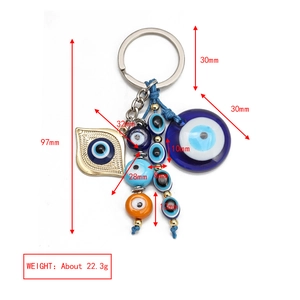 Detailed view of evil eye keychain showing 97mm total length with dimensions and weight
