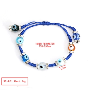Detail of adjustable evil eye beaded bracelet with colorful glass charms and silver spacers