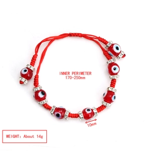 Detail of red braided Evil Eye bracelet with sparkling rhinestones and adjustable cord