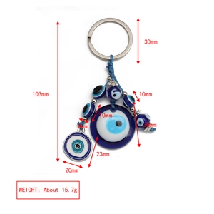Detailed view of evil eye keychain with measurements, showing dimensions and weight