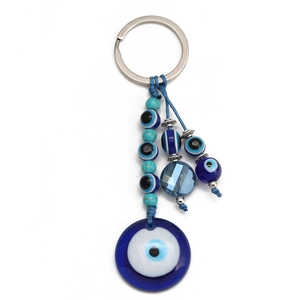 Detail of Evil Eye keychain with blue woven rope and polished blue glass beads