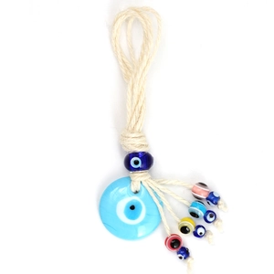 Detail of Turkish blue evil eye glass pendant with colorful beads and hemp rope