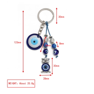 Detailed view of Evil Eye keychain with blue owl pendant and size dimensions