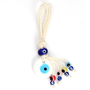 Detail of colorful Evil Eye charm with woven hemp rope and multicolor glass beads