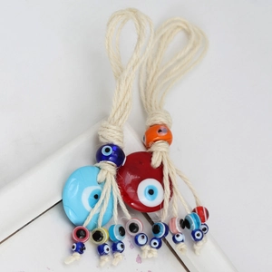 Handmade Evil Eye wall hanging decor with colorful glass beads and natural jute rope