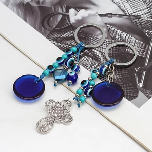 Blue Turkish evil eye glass keychain with turquoise beads and silver cross charm pendant