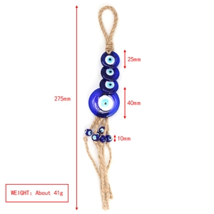 Detailed specs of Evil Eye glass charm with tassels and jute rope showing 275mm length