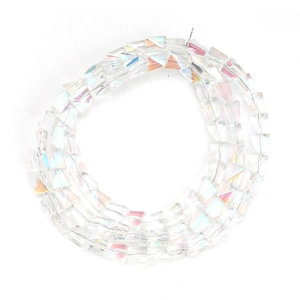 Macro detail of iridescent electroplated glass beads with irregular faceted shapes