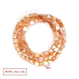 Macro shot of 8mm irregular amber glass beads with multifaceted cut for DIY jewelry