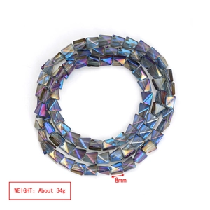 Macro detail of 8mm irregular trapezoidal glass beads with iridescent electroplated finish