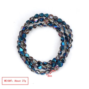 Detailed macro view of 6mm and 8mm iridescent glass beads with metallic plating