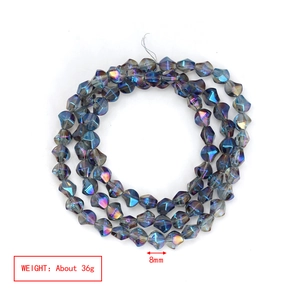 Macro detail of 8mm faceted iridescent glass beads with electroplated blue purple finish