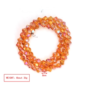 Macro view of 8mm amber multi-faceted irregular glass beads with polarized light effect