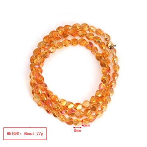 Macro detail of 6x8mm amber yellow faceted crystal glass beads for jewelry making