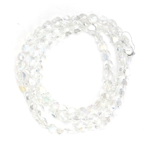 Detailed macro view of multifaceted yellow crystal glass beads with vibrant AB iridescent coating