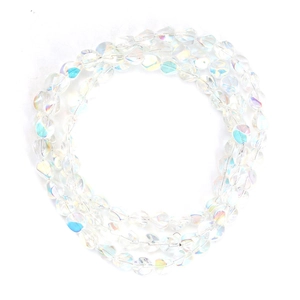 Detailed view of faceted iridescent glass beads for DIY jewelry with rainbow coating
