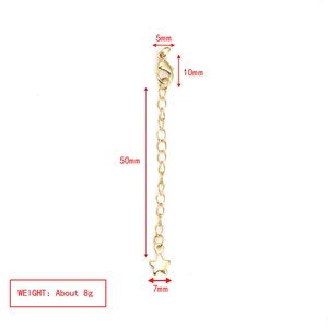 Detailed view of gold necklace extender with lobster clasp and star pendant charm