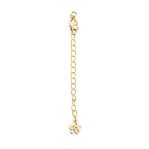 Close-up of gold extension chain with lobster clasp and textured flower pendant charm