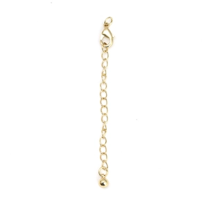 Golden necklace extender chain with lobster clasp and spherical pendant close-up