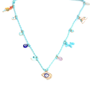 Close-up of handmade blue woven necklace with rainbow charms and blue evil eye beads