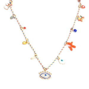 Detailed macro view of colorful woven necklace with multi-color charms and evil eye pendant