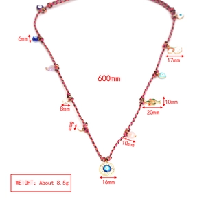 Detail view of colorful bohemian necklace with dimensions and multi-charm pendant weight