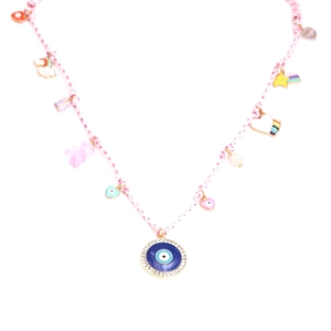 Detail view of pink braided necklace with colorful gummy bear, evil eye, and rainbow charms