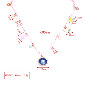 Pink woven necklace details showing gummy bear, evil eye, and rainbow pendants dimensions